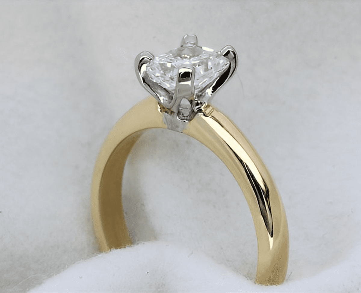 Gold engagement ring with diamond solitaire.