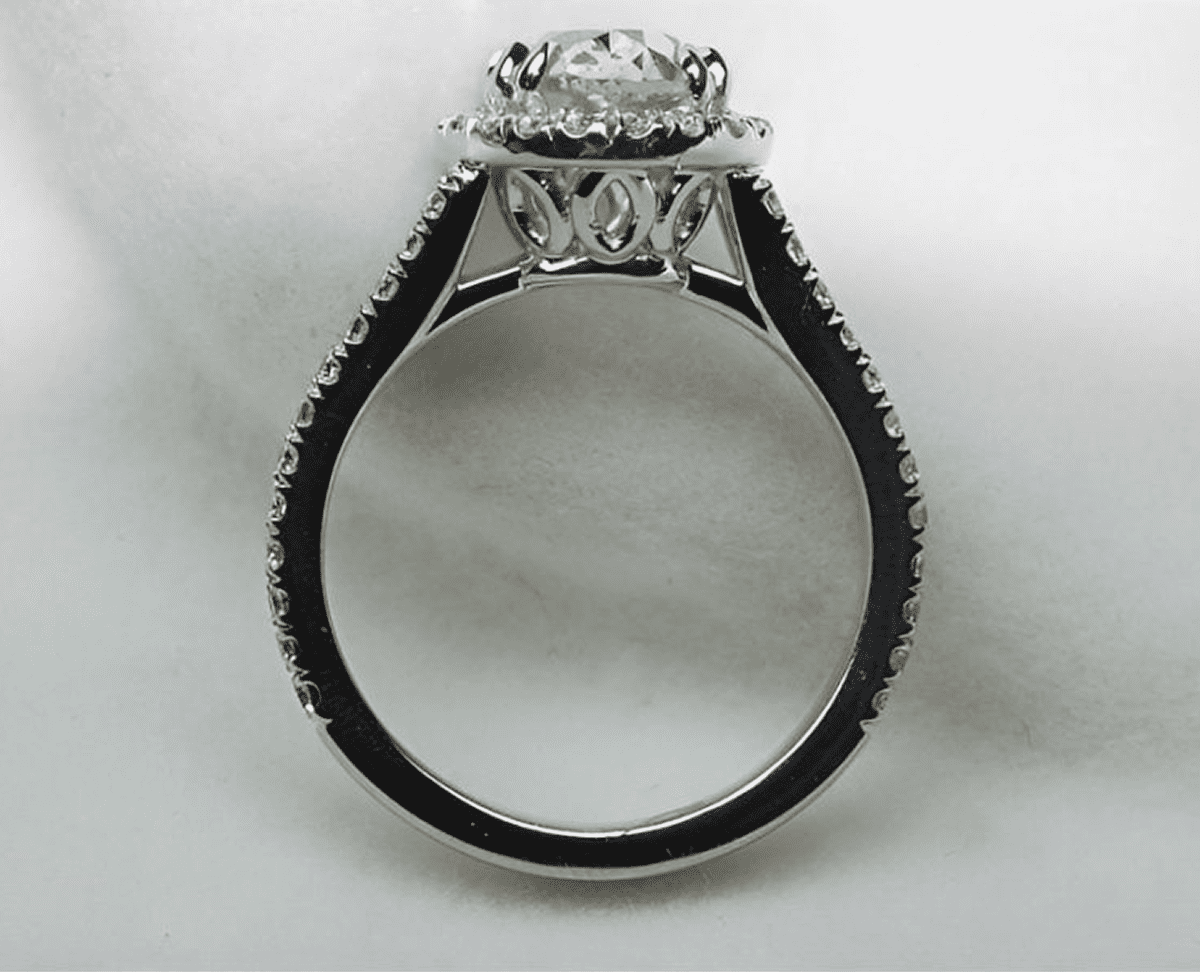 Diamond engagement ring with intricate band design.